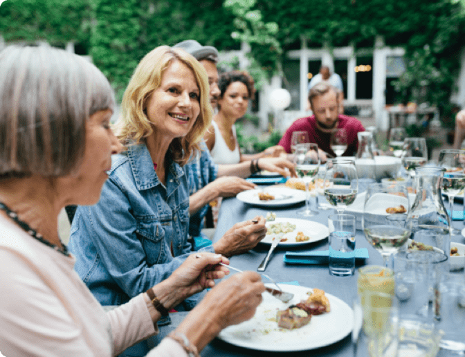 A woman eating dinner with her family