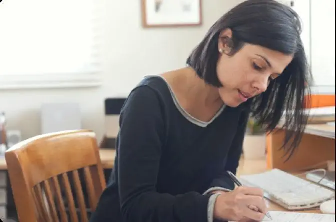 A woman taking notes 